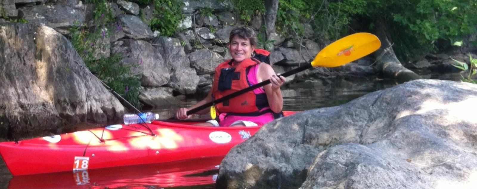 Dr. Jacqueline Marcin enjoying a sunny day kayaking on the water