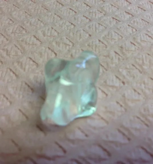 NTI-TSS Plus device, a small clear thermoplastic appliance that fits over the front teeth to prevent clenching